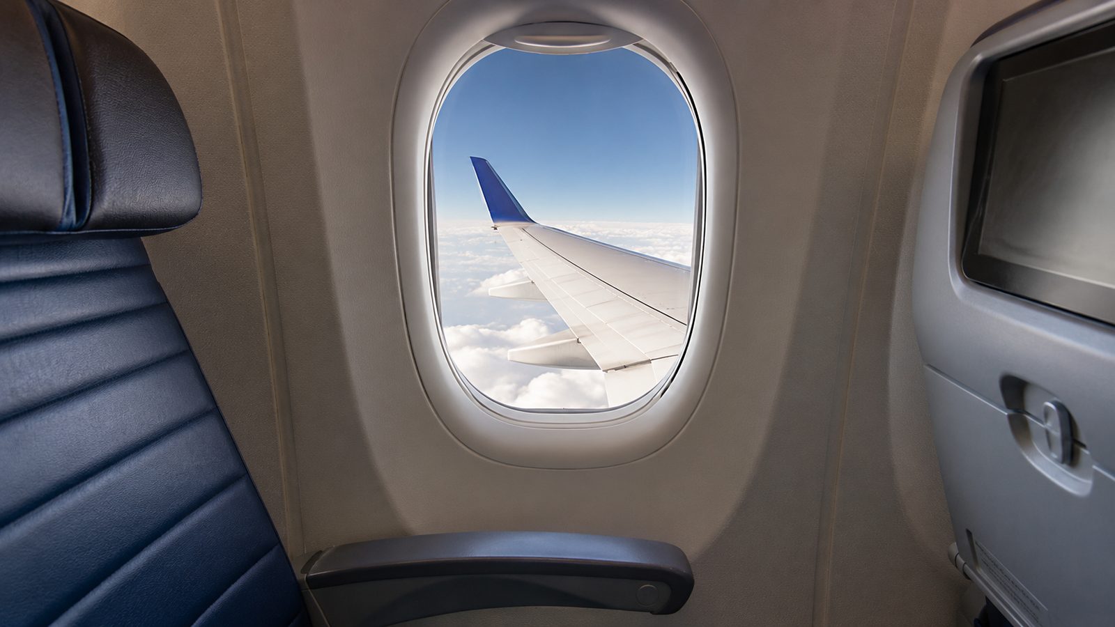 United PlusPoints 2026 — view from an airplane window seat over the wing and clouds